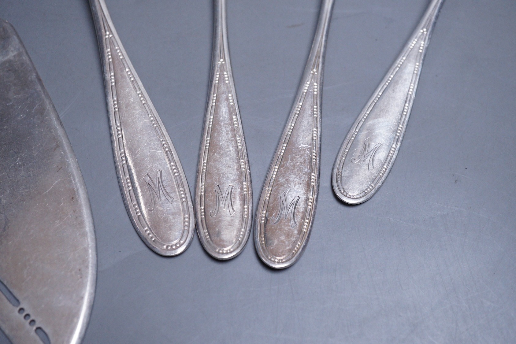 Five items of German 800 standard flatware including a pair of salad serves and a fish slice